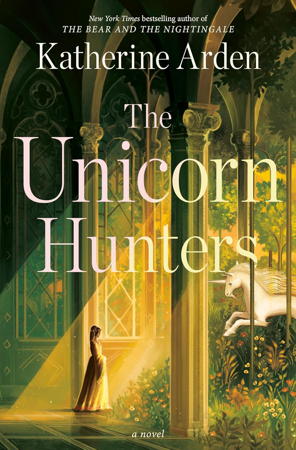 The atmospheric, dark fantasy book cover of The Unicorn Hunters by Katherine Arden, featuring a silver-horned silhouette against a snow-drenched, menacing pine forest.