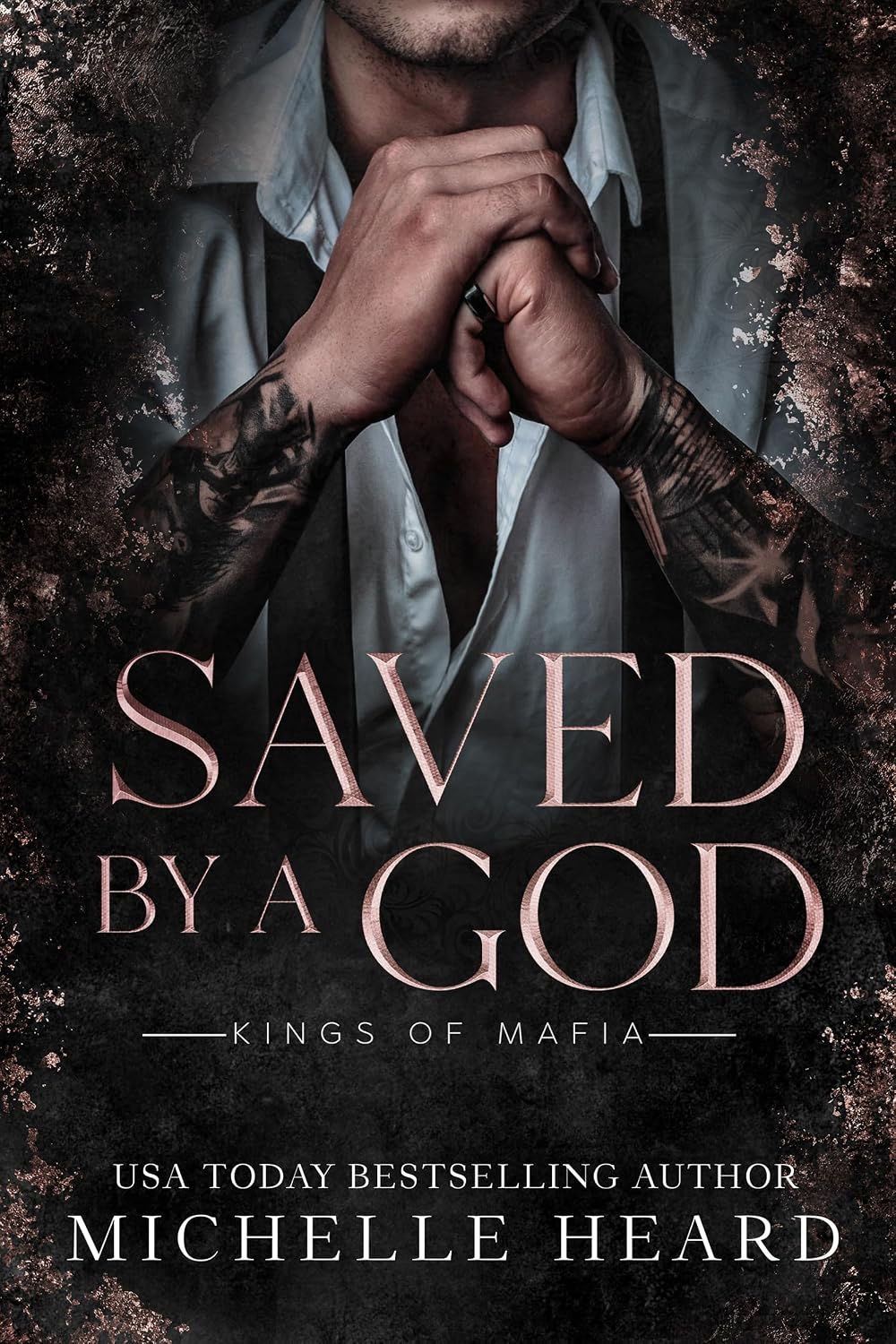 Close-up of a dark romance book cover for Saved By A God by Michelle Heard featuring dark thematic textures.