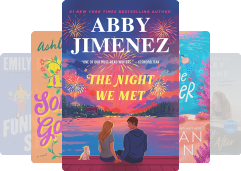 A flatlay of the five most popular books of June 2026 resting on a sandy beach towel with sunglasses.