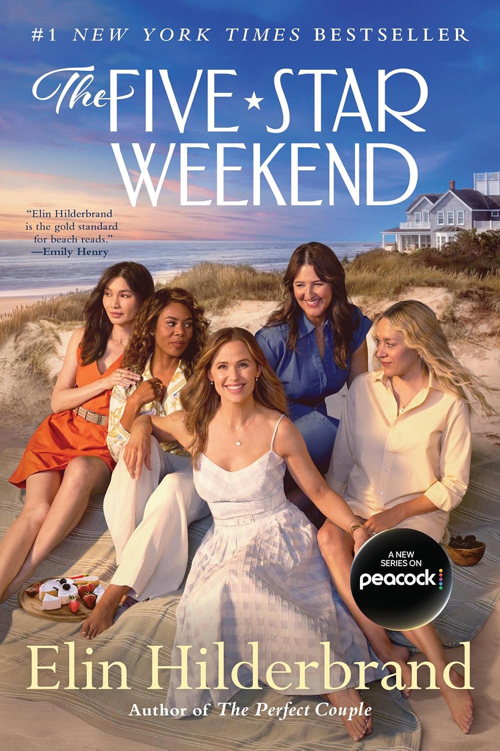 A luxury beach house on a grassy dune under a clear blue sky, capturing the ultimate Nantucket coastal aesthetic.